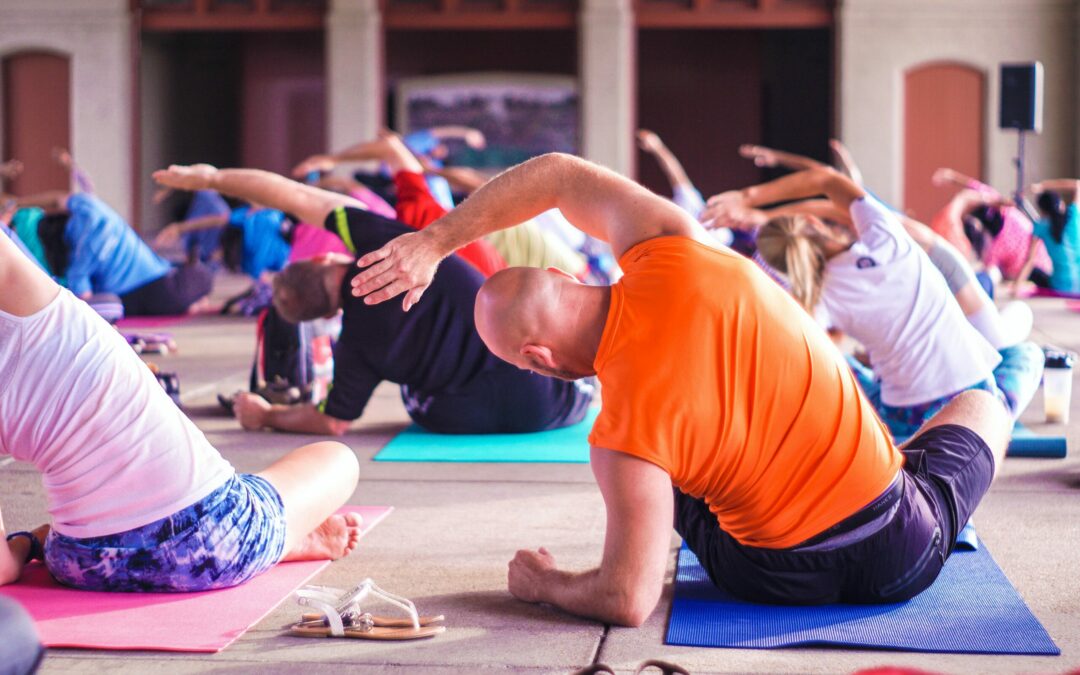 why wellness programs matter - employees doing yoga together